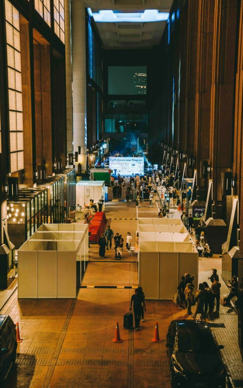 A group of people standing in a large building